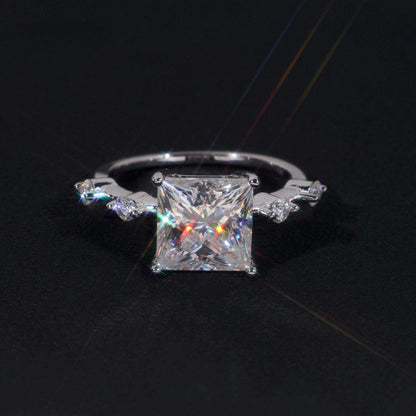 .925 SILVER PRINCESS CUT MOISSANITE ENGAGEMENT RING WITH ROUND SIDE STONES VTRG1010